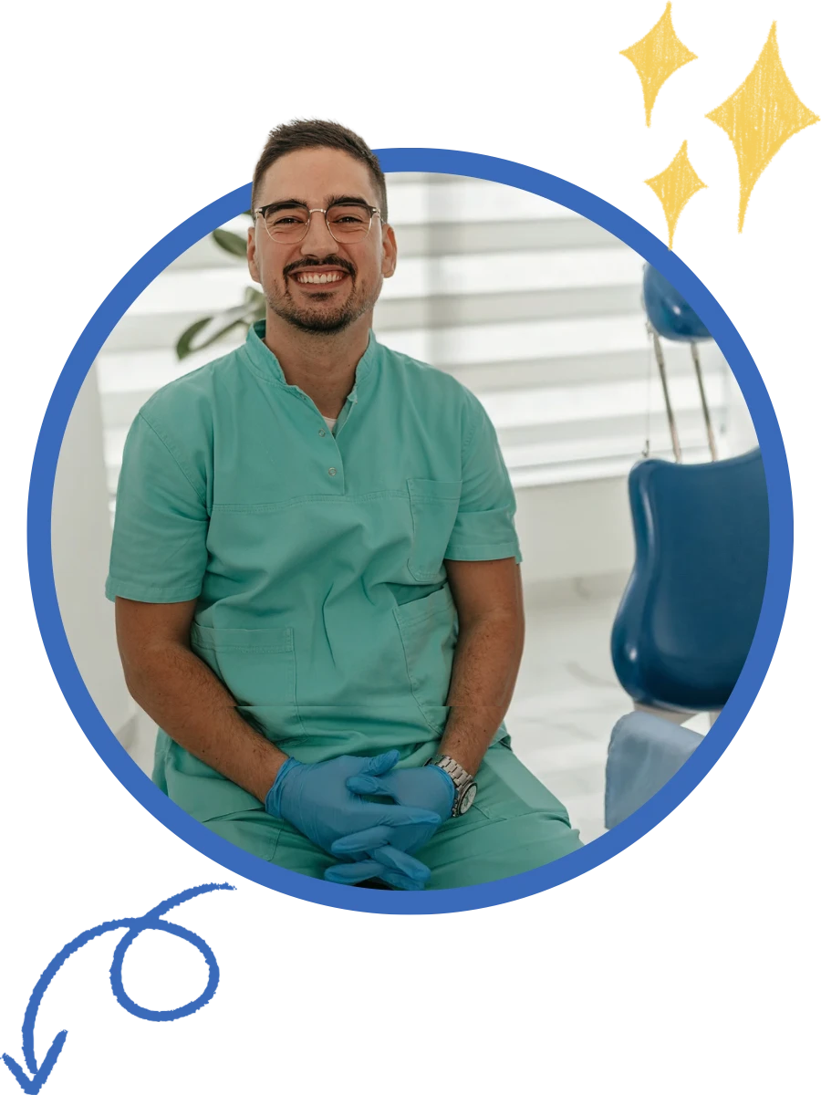 Friendly dentist in green scrubs at a modern Texas dental practice